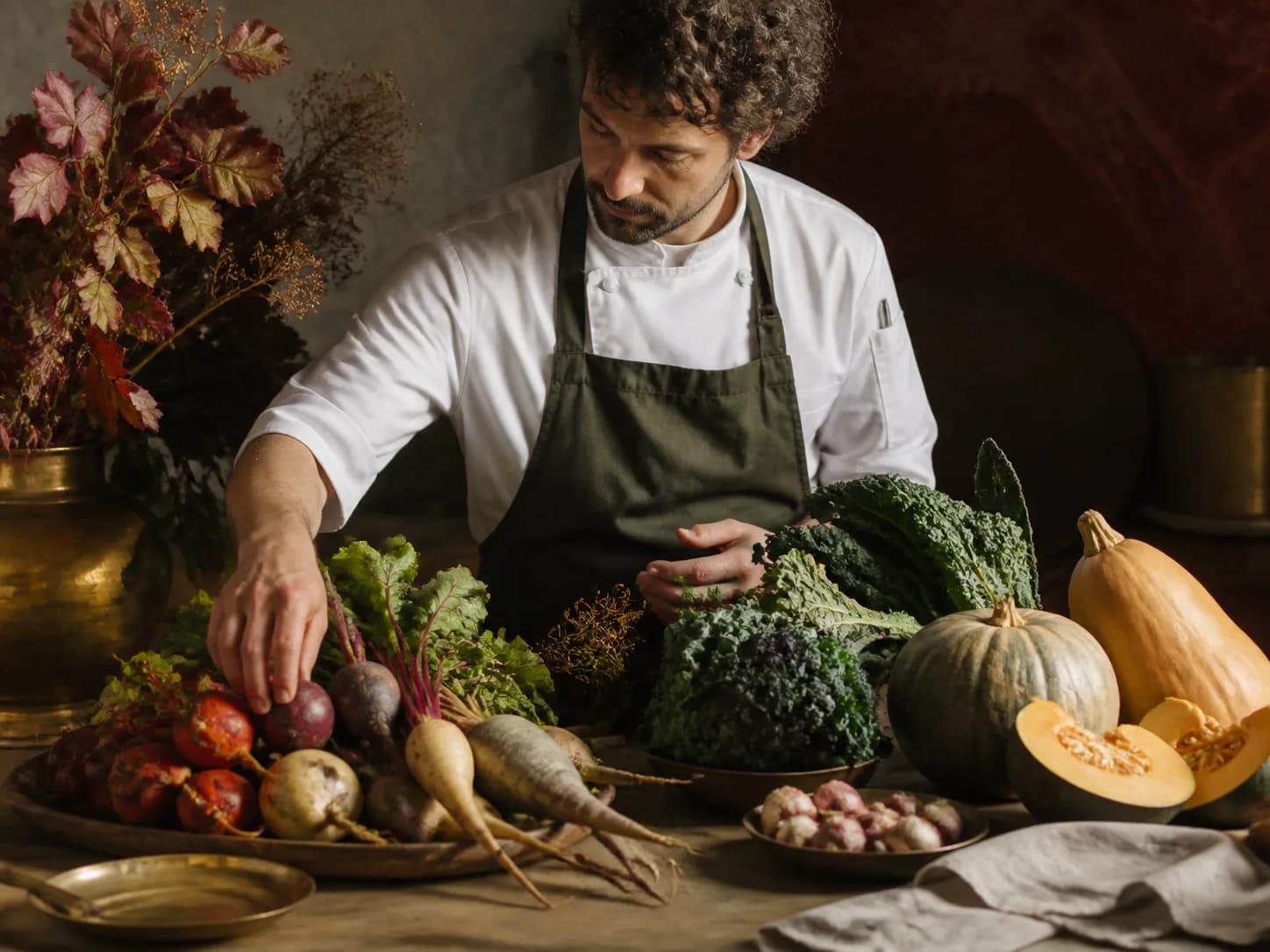 Chef selecting seasonal vegetables for the menu